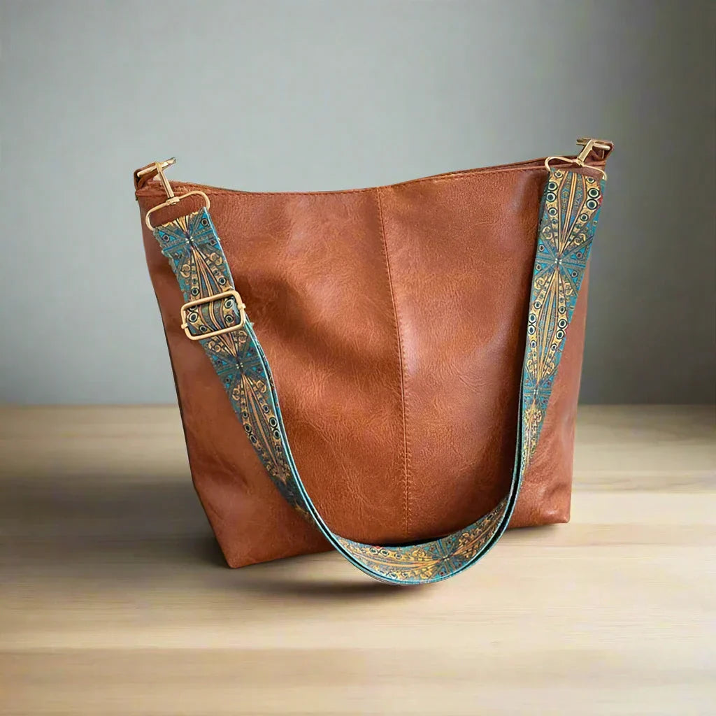 Vintage leren schoudertas voor vrouwen, gemaakt van hoogwaardig leer met verstelbare schouderriem en ruim binnenvak, ideaal voor dagelijks gebruik en speciale gelegenheden.