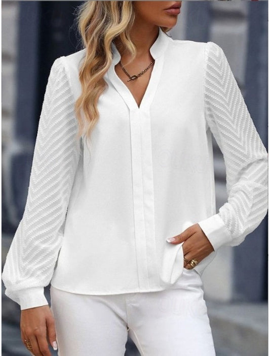 Stijlvolle zomertop met V-hals – licht, elegant en perfect voor warme dagen.