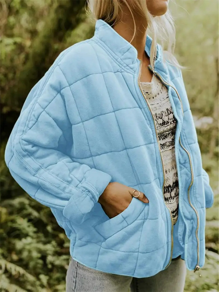Warme overgangsjas voor dames met quilting en een hoge kraag, ideaal voor herfst- en winterdagen.